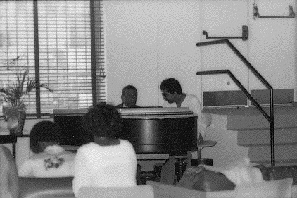 Claude Hopkins Teaching a Student at the Piano
