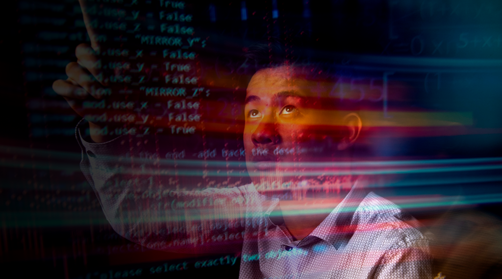 A man is looking upward with a focused expression, surrounded by colorful streaks of light and overlaid computer code. The scene conveys a blend of technology and concentration.